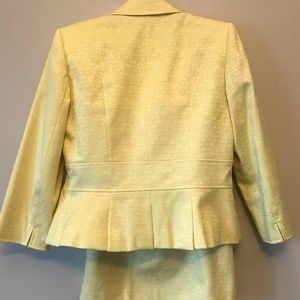 Below the knee pencil skirt and blazer with yellow stone buttons